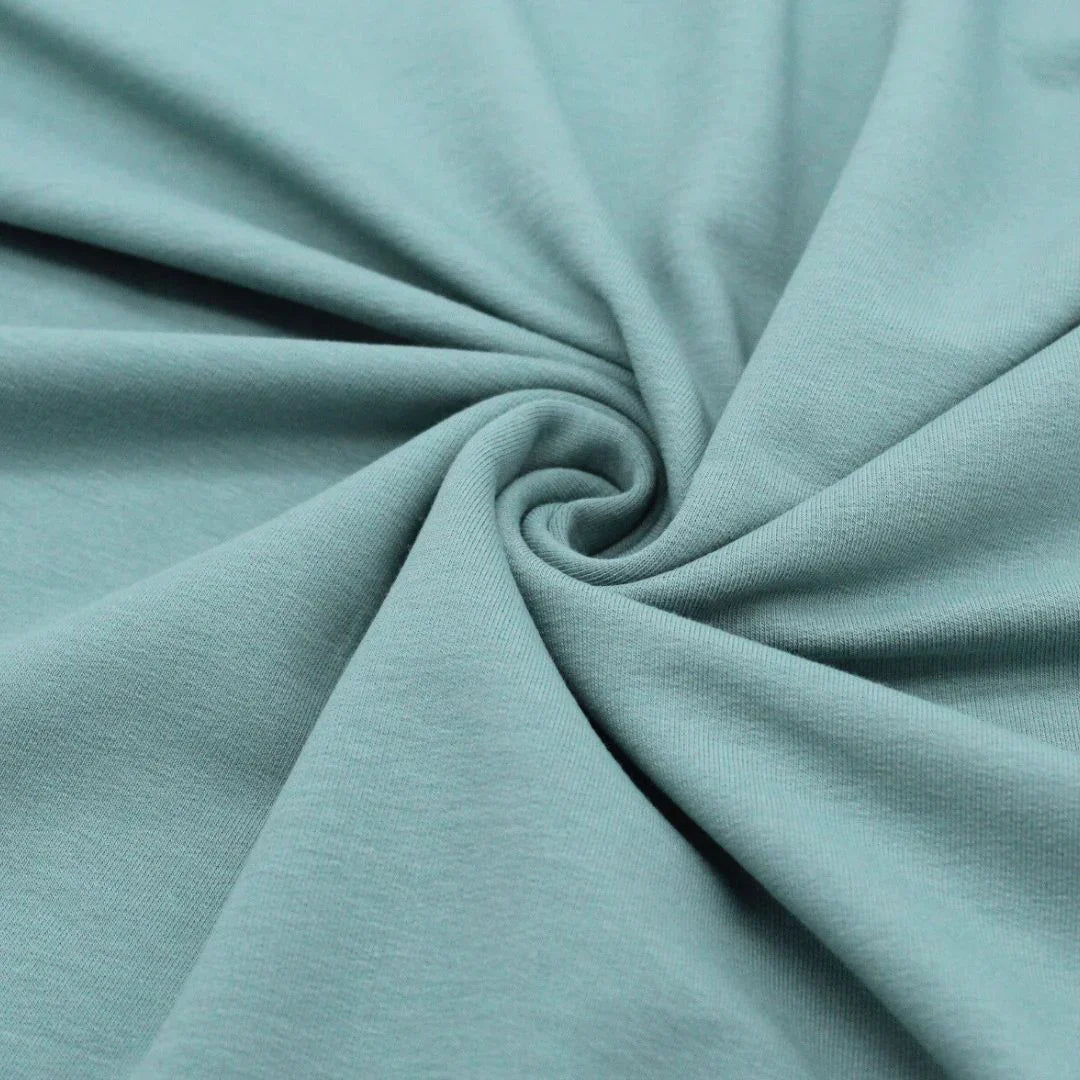 Detailansicht des nicht angerauten French Terry-Stoffs, ideal für die Herstellung von Sweatshirts und Freizeitkleidung.