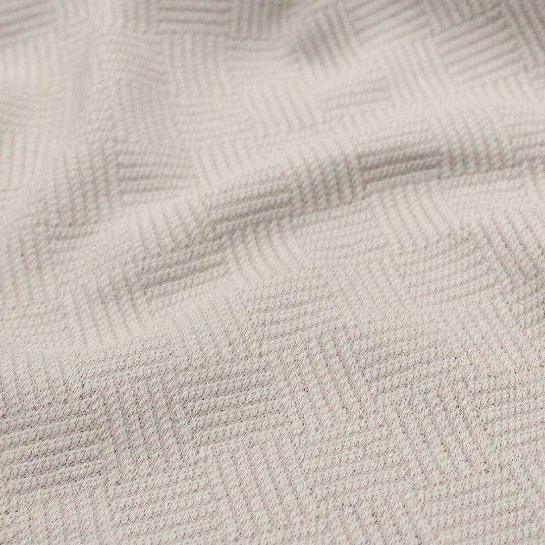 Baumwolljacquard-Stoff in Sand – Detailaufnahme der gewebten Struktur und Muster.