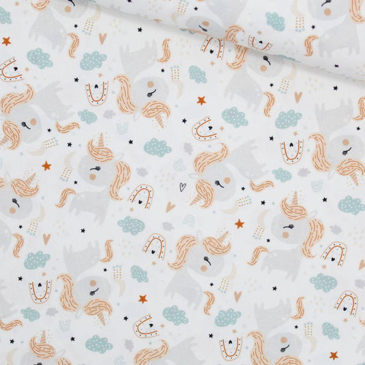 Baumwollstoff mit Einhorn, Regenbogen und Sternen in Pastellfarben auf Ecru-Hintergrund