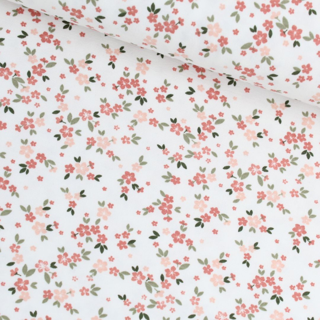 Jersey Stoff auf Ecru mit kleinen rosa Blümchen – elastisch und weich