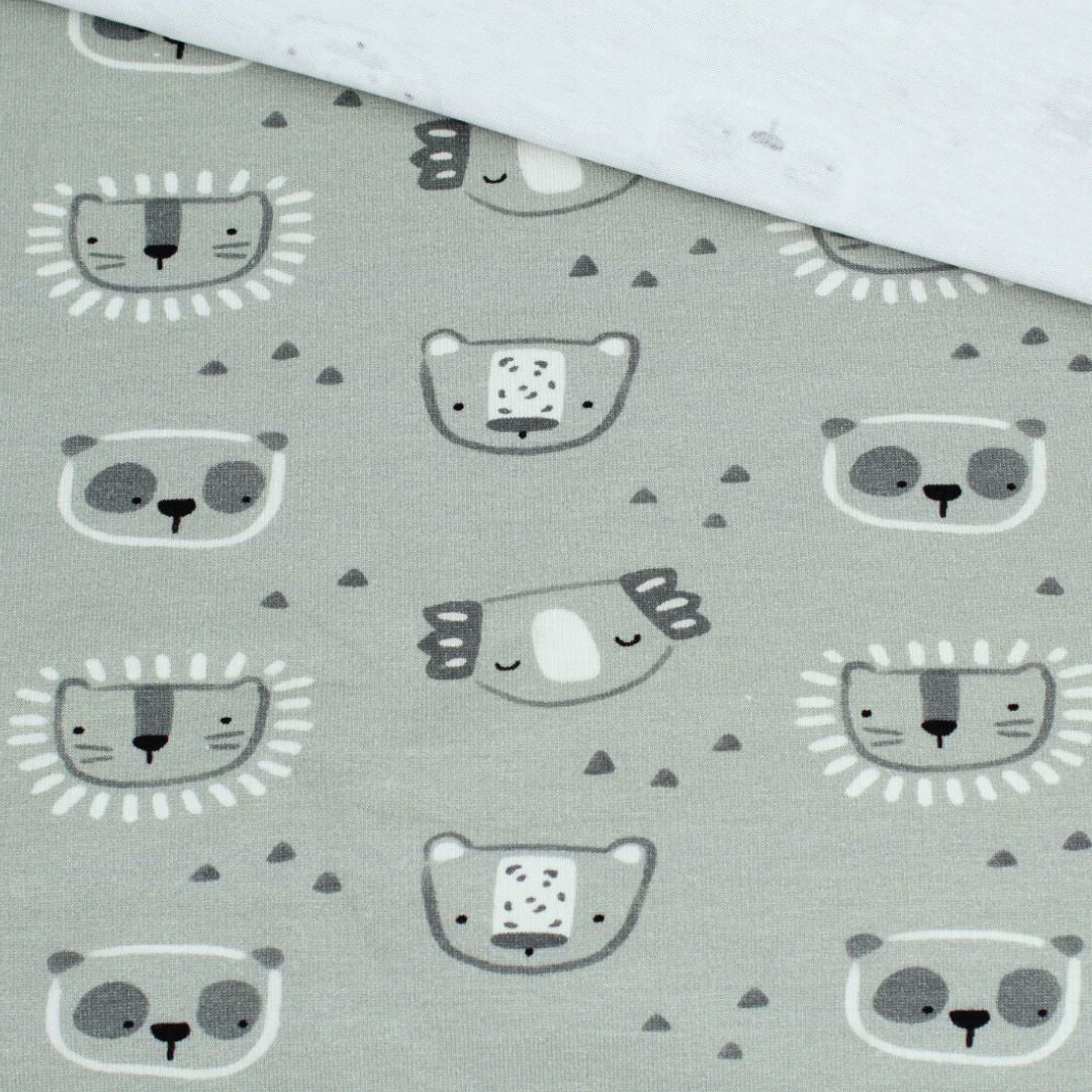 Detailansicht des Motivs: Koala & Panda auf frischem grünem Jersey-Stoff