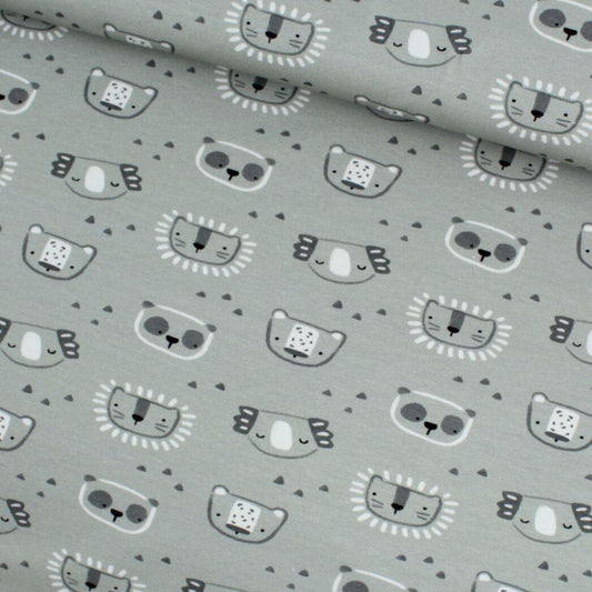 Nahaufnahme vom Jersey-Stoff mit Koalas und Pandas auf grünem Hintergrund