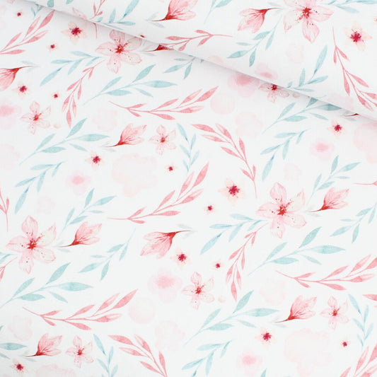 Jersey Stoff Blumenparadies mit zartrosa und blauen Blumen auf weißem Hintergrund – ideal für Baby- und Kinderkleidung