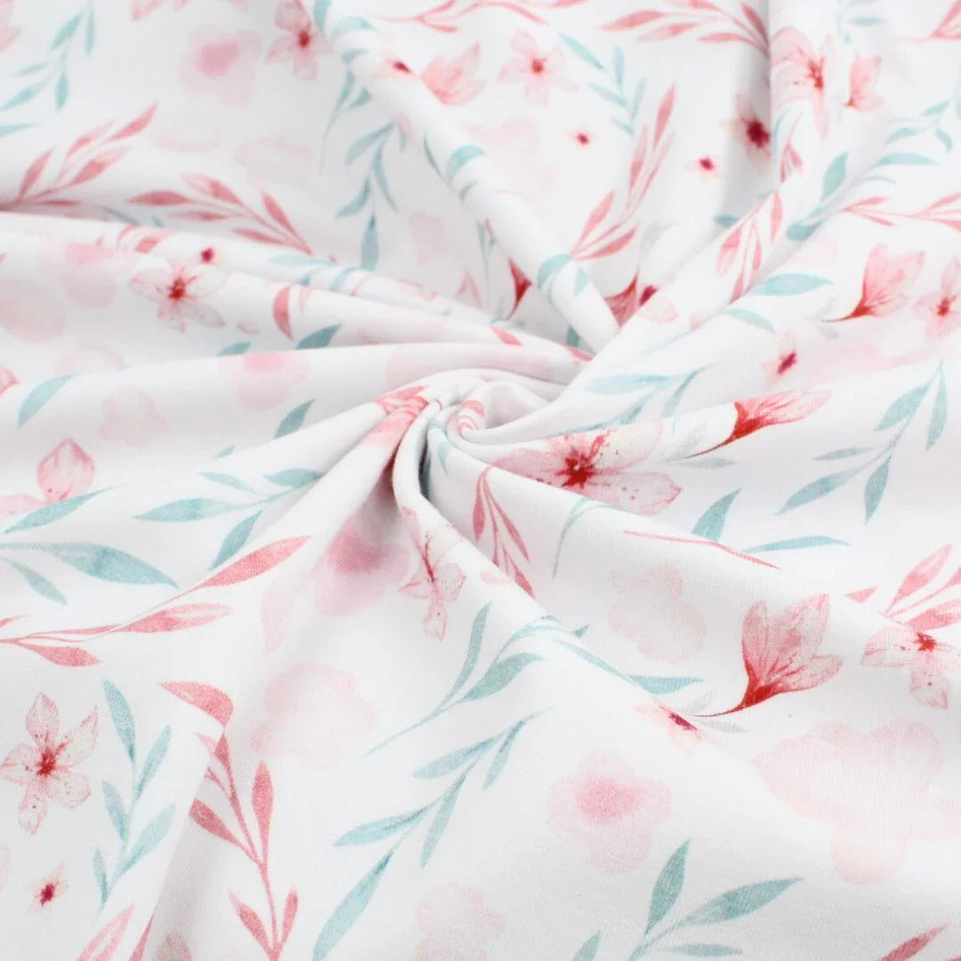 Baumwolljersey mit floralem Muster in Rosa und Blau – weicher, dehnbarer Stoff für Kindermode und Accessoires