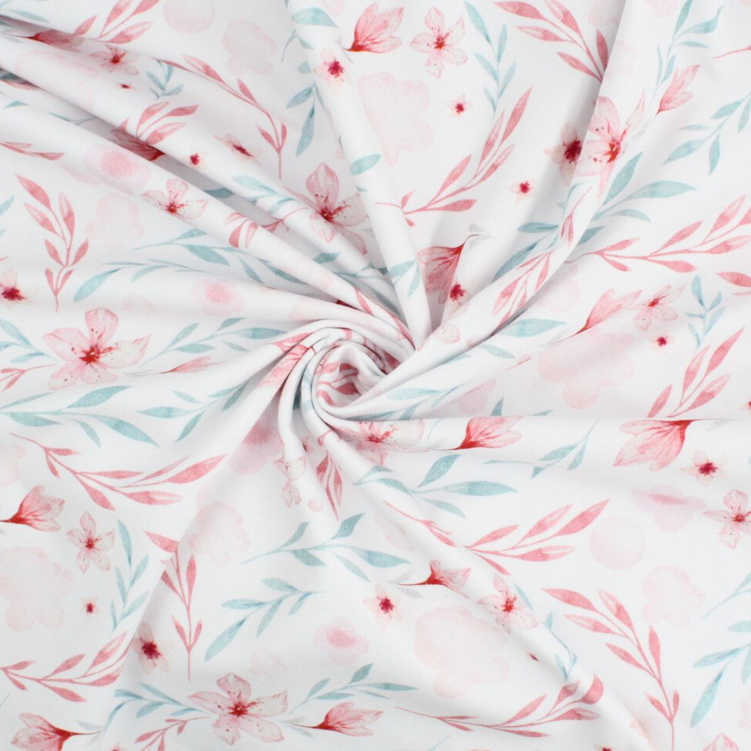 Kinderstoff Jersey in Weiß mit romantischem Blumenprint in Pastellfarben – OEKO-TEX zertifiziert