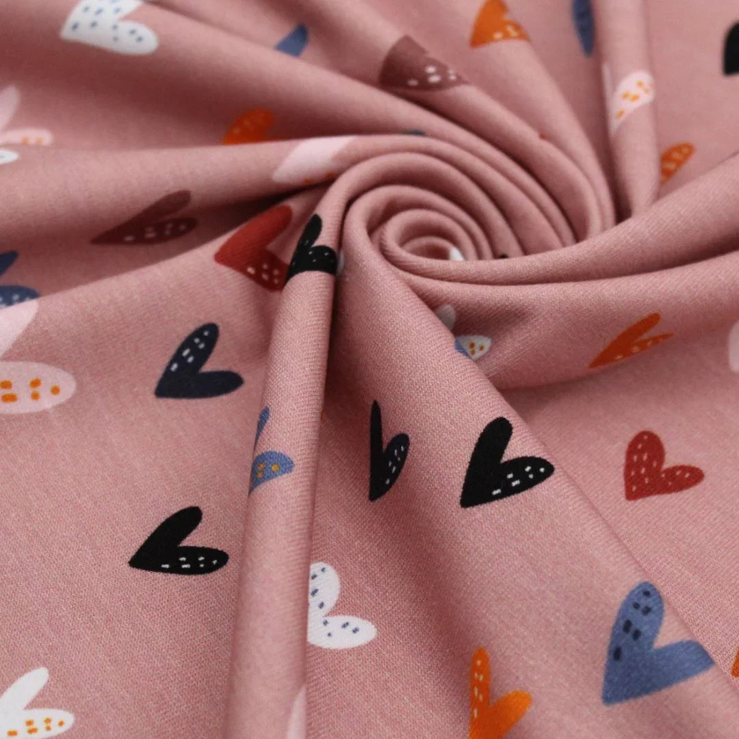 Jersey Meterware bunte Herzen auf Rosa