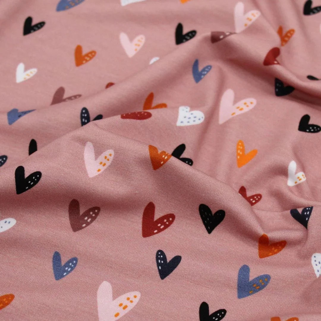 Weicher Jersey bunte Herzen auf Rosa