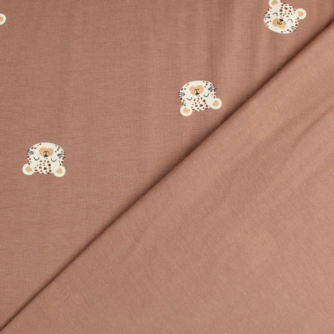 Detailansicht: Jersey Stoff mit Leoparden-Gesichtern – OEKO-TEX zertifiziert