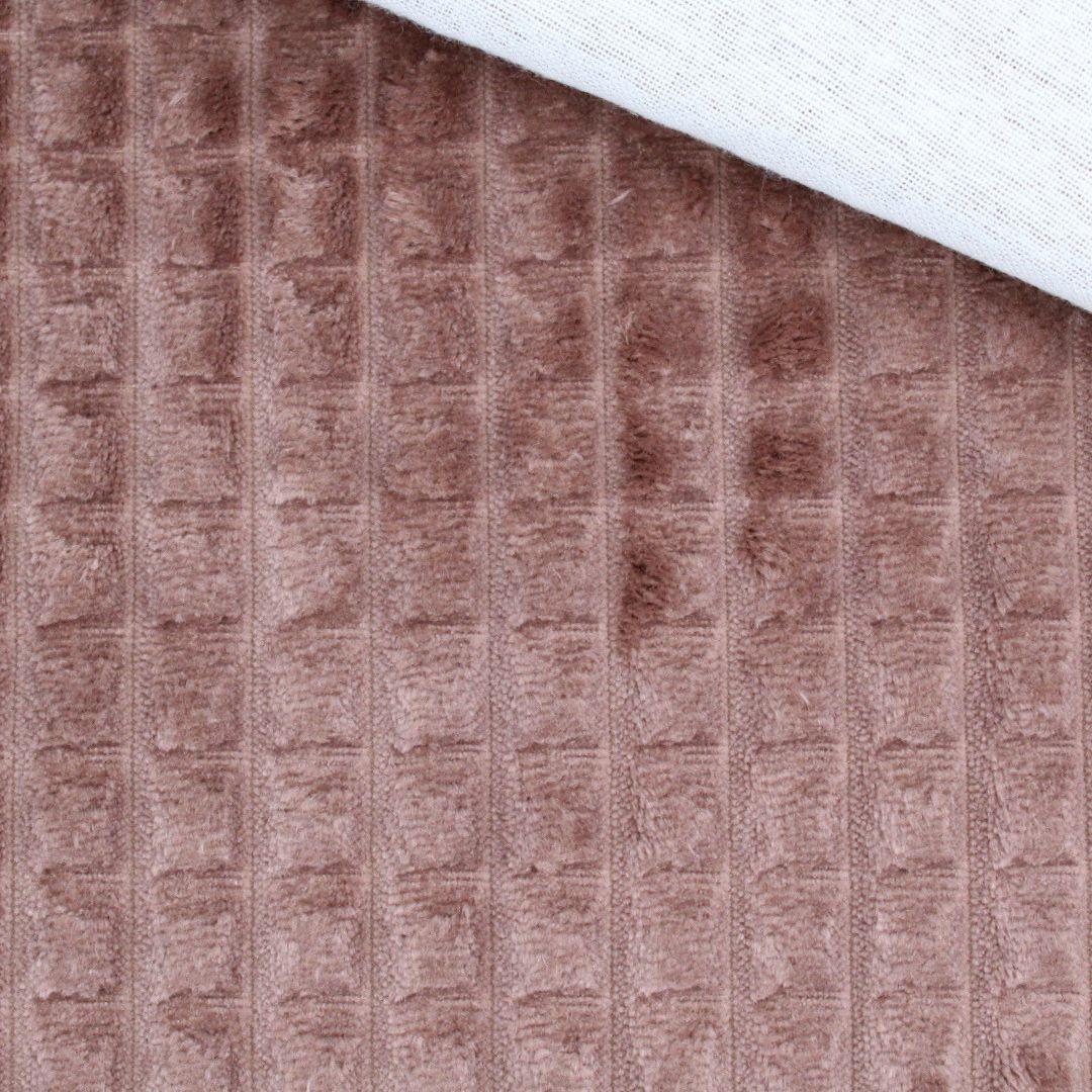 Nahaufnahme vom Velour Polsterstoff in Braun mit Quadratten-Muster