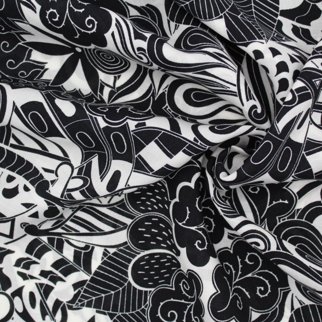 Leichter Viskose-Voile-Stoff in Schwarz-Weiß mit abstraktem Muster, perfekt für die Herstellung von Strandkleidern, Blusen und Röcken.