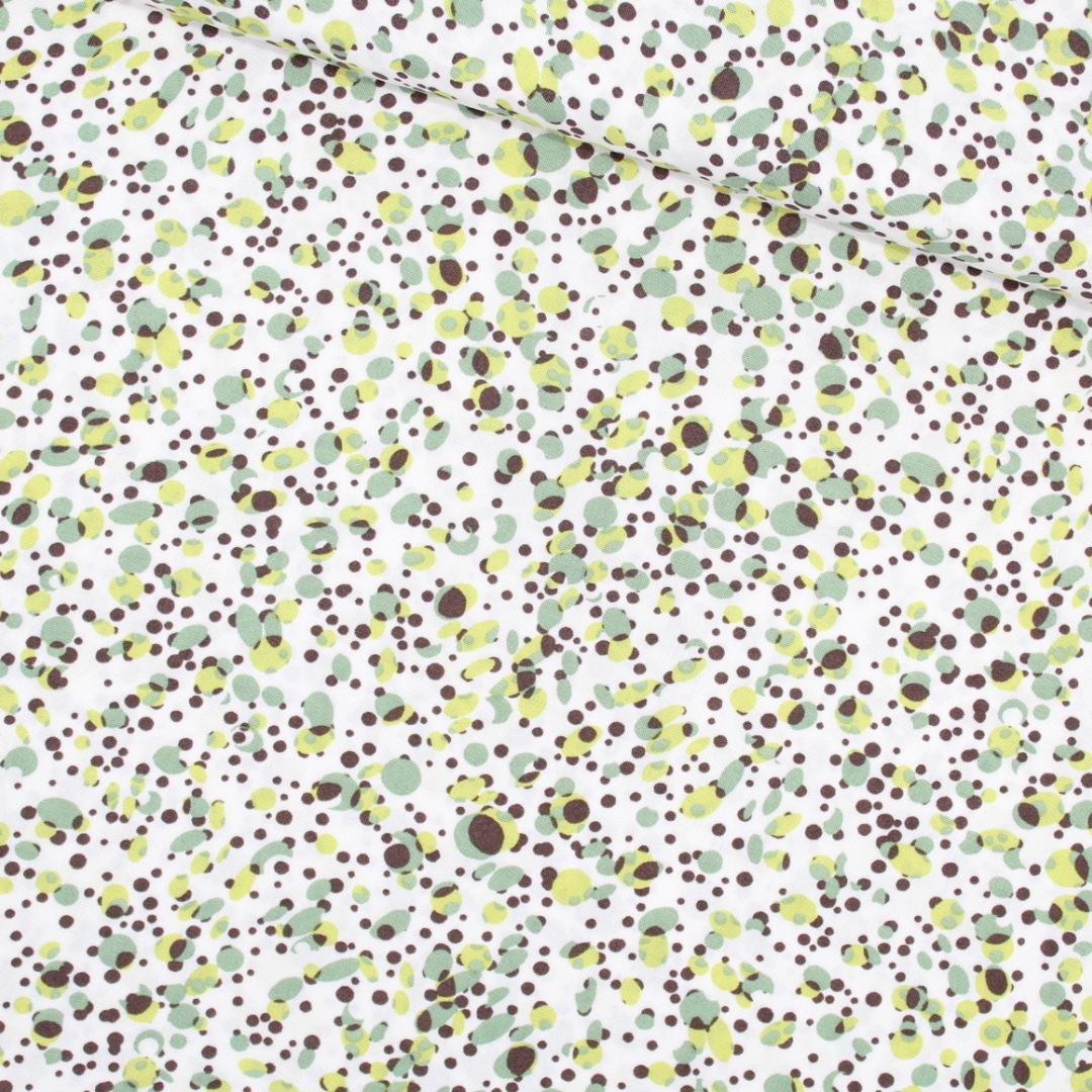 Viskosestoff mit kleinen grünen Punkten, ideal für Kleider, Blusen und Röcke. Stoffball