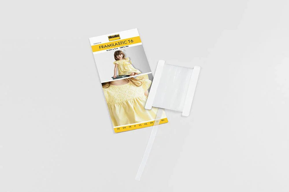 Vlieseline Framilastic T6 - elastisches Nähband in transparenter Ausführung, 6 mm breit und 5 m lang, ideal für dehnbare Kleidung und kreative Nähprojekte.
