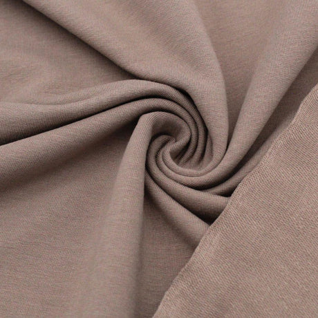 Detailansicht des nicht angerauten French Terry-Stoffs, ideal für die Herstellung von Sweatshirts und Freizeitkleidung.