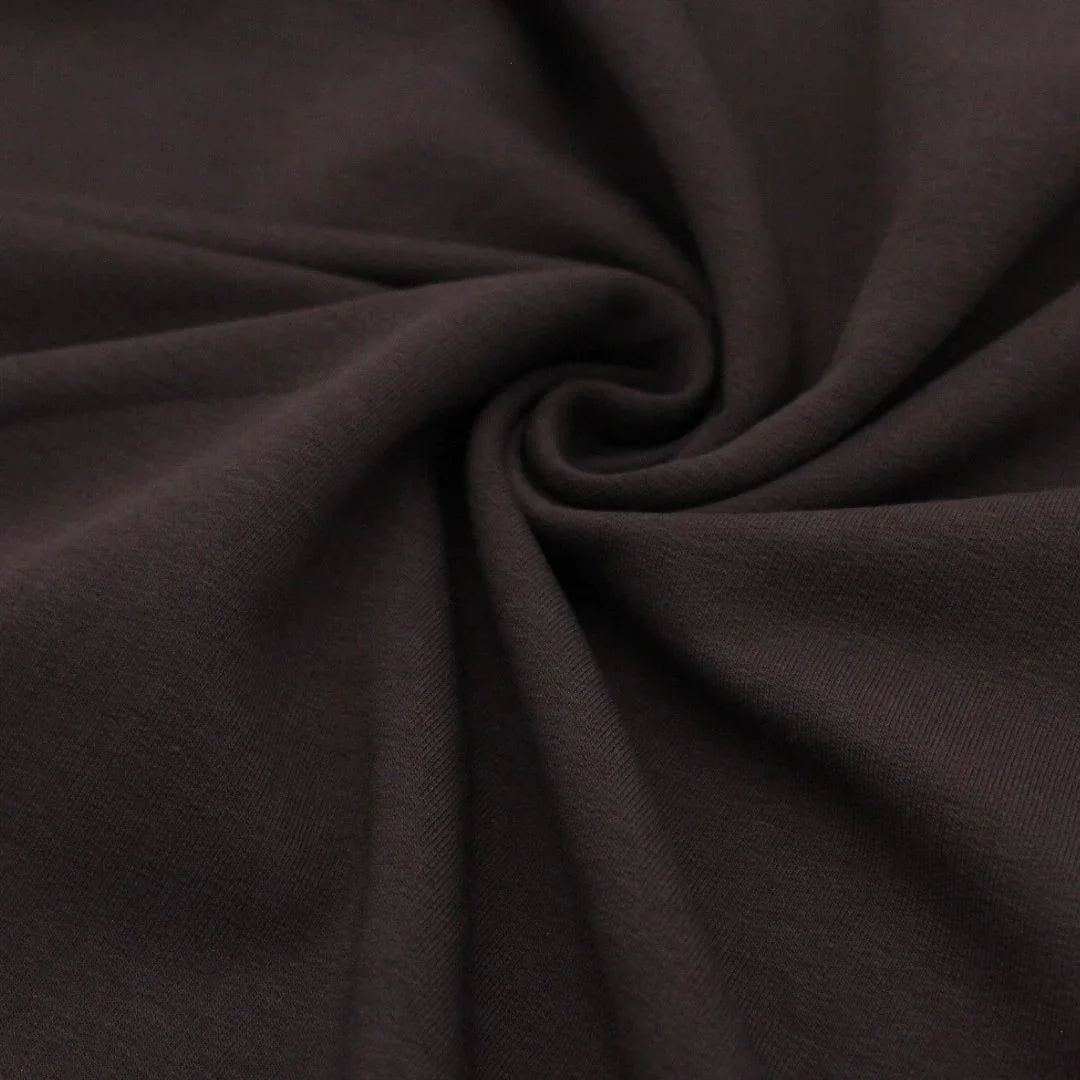 Detailansicht des nicht angerauten French Terry-Stoffs, ideal für die Herstellung von Sweatshirts und Freizeitkleidung.