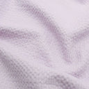 Leichte Baumwolle mit Bienenwaben-Jacquard-Struktur, ideal für die Herstellung von Sommerblusen, Tops und Kleidern – strapazierfähig und pflegeleicht. Pastell Lila