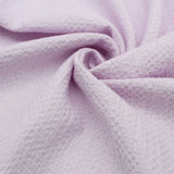 Leichte Baumwolle mit Bienenwaben-Jacquard-Struktur, ideal für die Herstellung von Sommerblusen, Tops und Kleidern – strapazierfähig und pflegeleicht. Pastell Lila