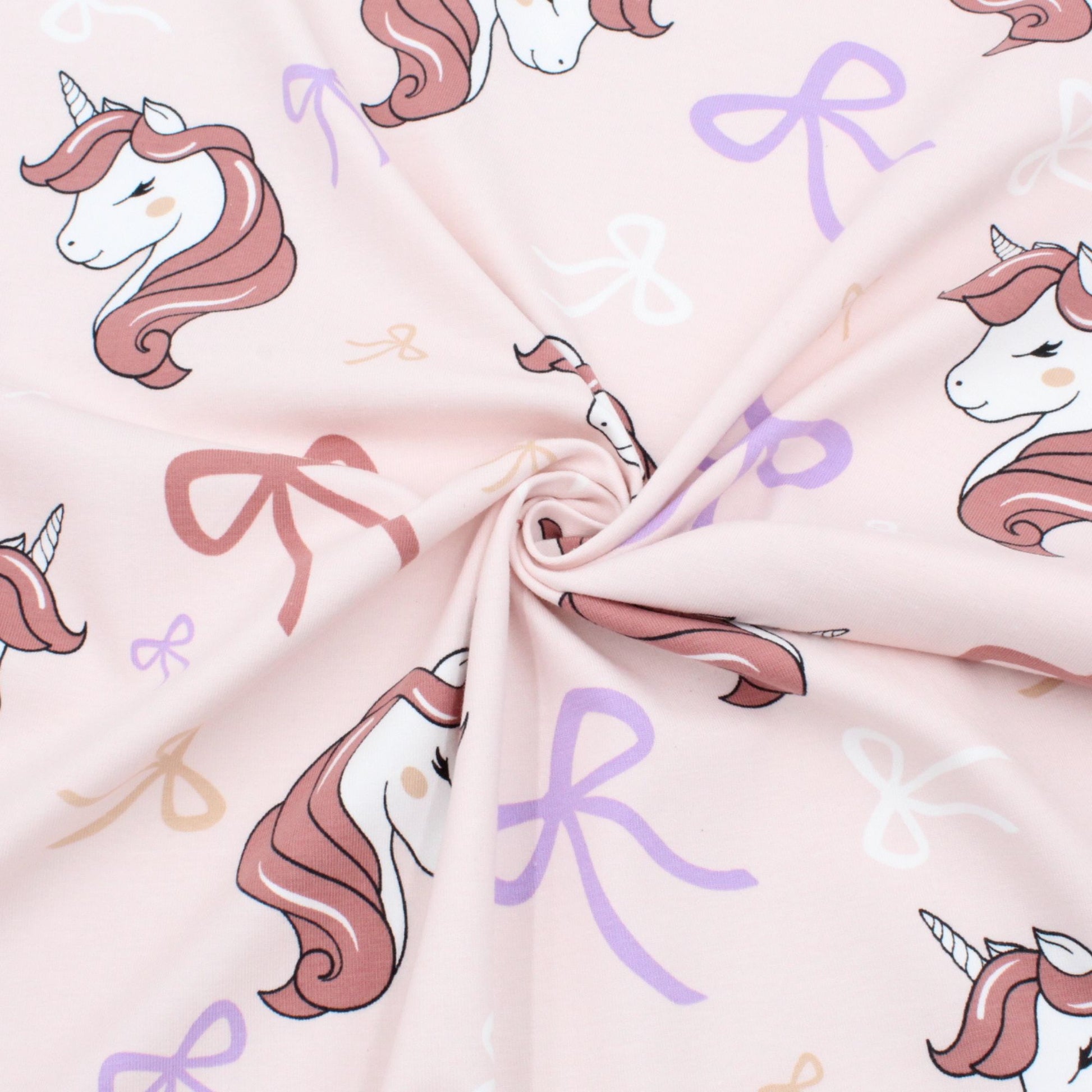 Stoff mit Einhörnern und Schleifen rosa Kinderstoff Jersey Meterware