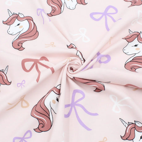 Stoff mit Einhörnern und Schleifen rosa Kinderstoff Jersey Meterware