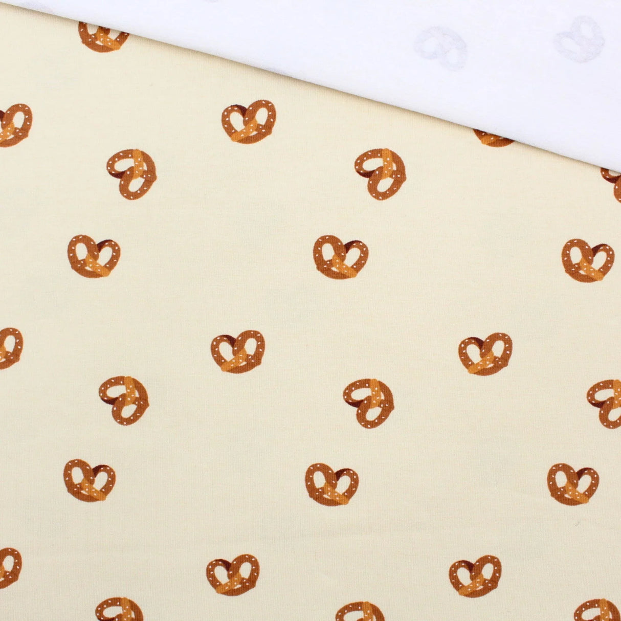 Jersey Stoff Brezel Beige