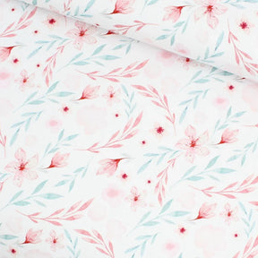 Jersey Stoff Blumenparadies mit zartrosa und blauen Blumen auf weißem Hintergrund – ideal für Baby- und Kinderkleidung