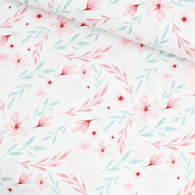 Jersey Stoff Blumenparadies mit zartrosa und blauen Blumen auf weißem Hintergrund – ideal für Baby- und Kinderkleidung