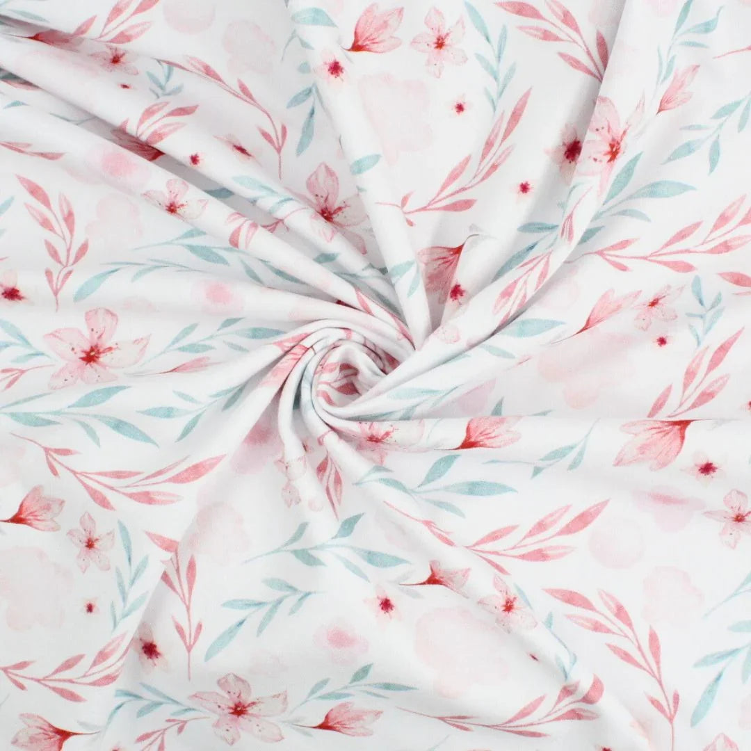 Kinderstoff Jersey in Weiß mit romantischem Blumenprint in Pastellfarben – OEKO-TEX zertifiziert