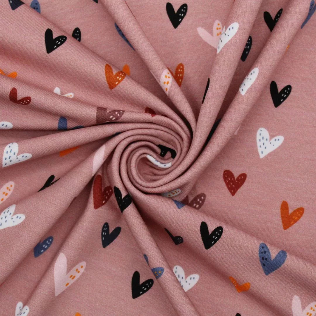 Atmungsaktiver Jersey mit bunte Herzen auf rosa