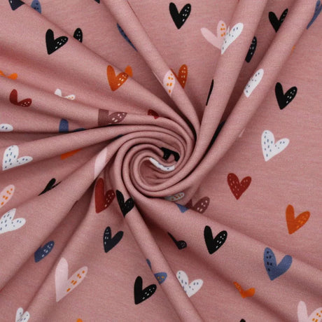 Atmungsaktiver Jersey mit bunte Herzen auf rosa