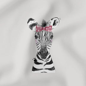 Weiches Jersey Panel mit Zebra-Motiv und rosa Schleife auf grauem Hintergrund für Kinderkleidung.