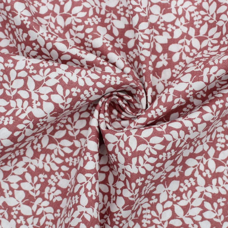Baumwollpopeline mit kleinen Blättern in Mauve, ideal für Nähprojekte wie Babydecken, Kissenbezüge und Turnbeutel. Nahaufnahme