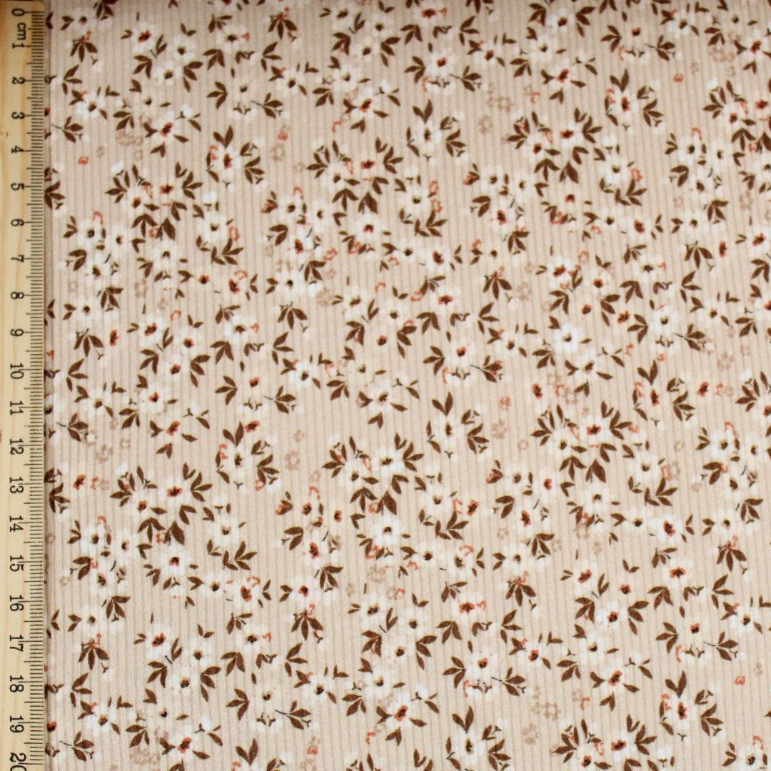 Rippenjersey kleine weißen Blumen auf Beige Mustergröße