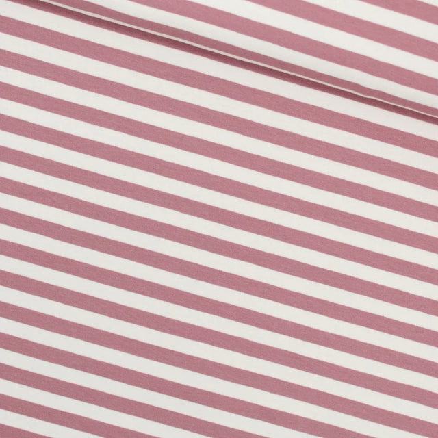 Nahaufnahme des French Terry Stoffes mit zarten rosa Streifen auf einer weichen und elastischen Oberfläche, ideal für bequeme Kleidung.