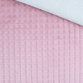 Nahaufnahme vom Velour Polsterstoff in Rosa mit Quadratten-Muster