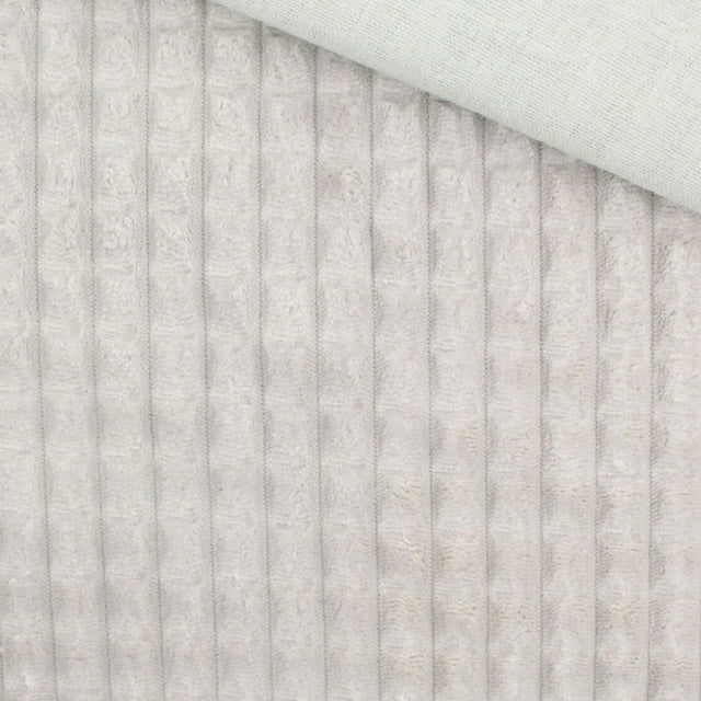Nahaufnahme vom Velour Polsterstoff in Sand mit Quadratten-Muster