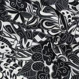 Leichter Viskose-Voile-Stoff in Schwarz-Weiß mit abstraktem Muster, perfekt für die Herstellung von Strandkleidern, Blusen und Röcken.