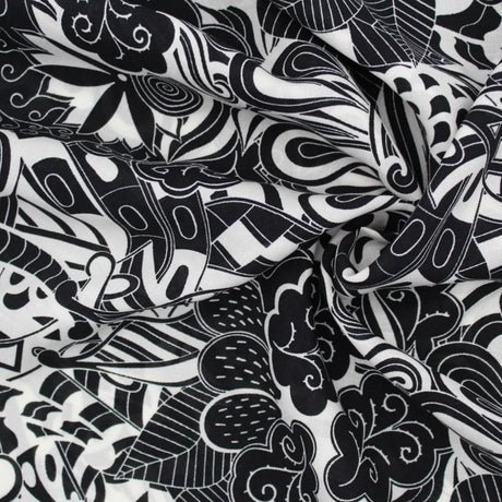 Leichter Viskose-Voile-Stoff in Schwarz-Weiß mit abstraktem Muster, perfekt für die Herstellung von Strandkleidern, Blusen und Röcken.