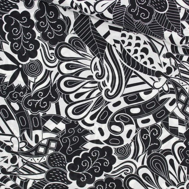 Viskose-Voile-Stoff in Schwarz-Weiß mit abstraktem Muster, perfekt für die Herstellung von Strandkleidern, Blusen und Röcken. Stoffball