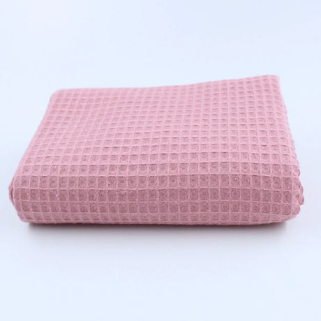 Leichter und hautfreundlicher Waffelstoff in Rosa – ideal für DIY-Nähprojekte und nachhaltige Textilien.
