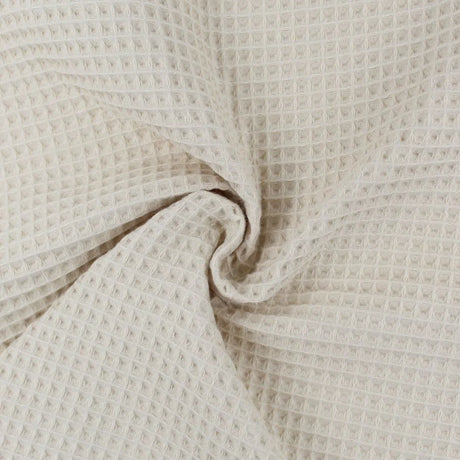 Strukturierter Waffelpique in einem warmen Beige-Farbton, pflegeleicht und vielseitig einsetzbar.