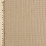 Fein gewebter Waffelstoff in Kamelbraun-Ton, ideal für Heimtextilien und Bekleidung.