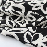 Viskose Nylon Weiße Blumen | Schwarz - Stofftime
